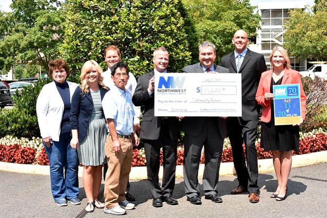 Northwest Federal Credit Union, headquartered in Herndon, donated more than $12,000 to five community partners. Each received a donation of $2,324. Representing their organizations are (from left): Peggy Brooks, Northwest Federal Credit Union Foundation; Tiffany Lawrence, Appalachian Trail Conservancy; Fletcher Wells, Cornerstones; Carl Kikuchi-Audubon and Jason DiMambro, Arts Herndon; Jeff Bentley, Acting CEO/president NWFCU/chair of the foundation; Joe Talmadge, vice president Mortgage Lending, NWFCU; and Michelle Sandy, mortgage business development specialist, NWFCU.
