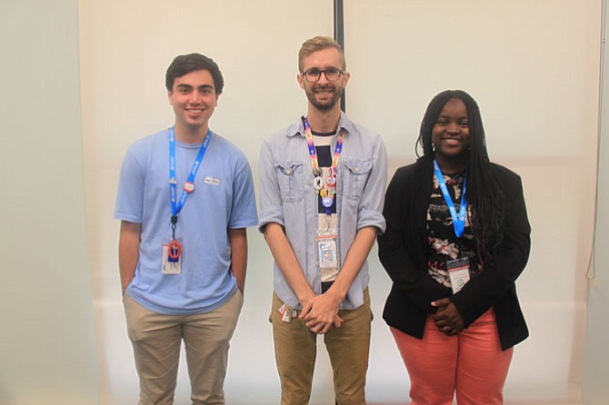 Teen Services Coordinator Isaiah West (center) with summer interns Josh Habib (left) and Divine Tsasa Nzita. 
