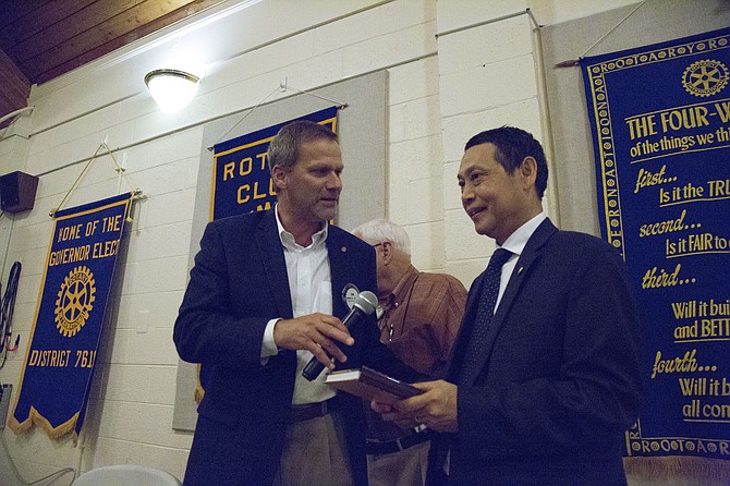 McLean Rotary Club President Robert Jansen presented Myanmar Ambassador to the U.S. Aung Lynn with a small token of appreciation for speaking at his club’s meeting: A “Rotary Flavors of the World Cookbook” that contained a collection of more than 400 recipes from Rotary clubs from more than 150 countries.
