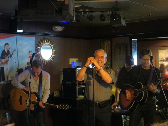 Chief Michael Brown (center) sings “Footloose” with Michael Bacon (left) and Kevin Bacon (right)