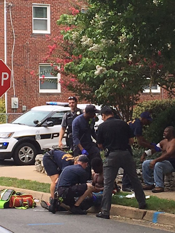 Victims of the shooting on the curb of E. Howell Avenue.