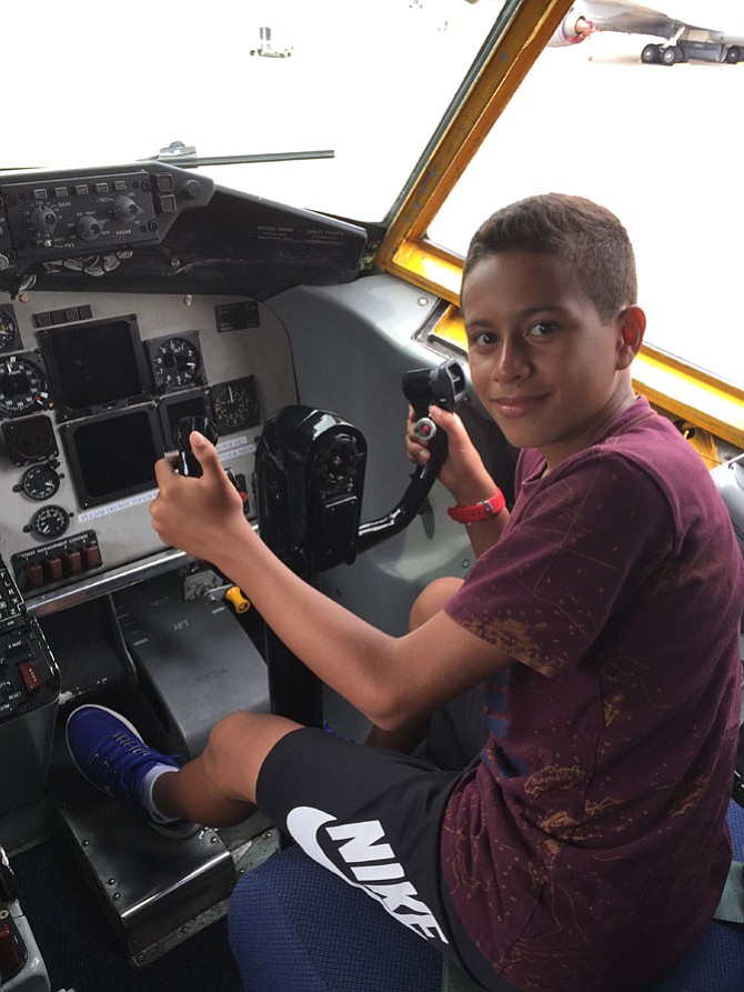 Santiago in a plane at Andrews Air Force Base where Eddie Miller used to fly planes.
