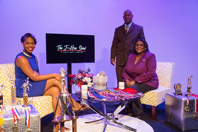 Jessica Honesty poses on her set for “The J-Hon Show” at Fairfax Public Access Sunday morning with her father Kenneth Honesty, 58, retired, and her mother Pamela Honesty, 55, a staff accountant.