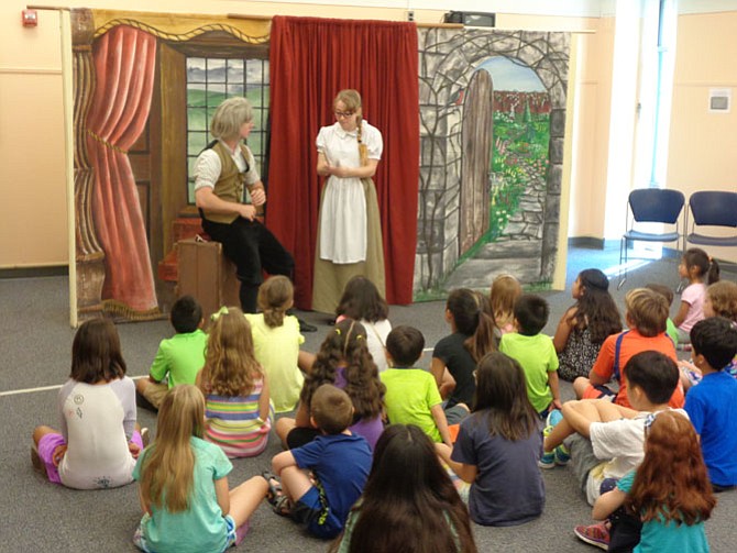 Hampstead Stage actors Ian Emerson (left) and Katie Marsh (right) performed “Beauty and the Beast” at Kings Park Library on Tuesday morning.