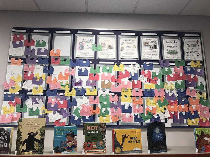 A colorful wall of children’s names brightens up the library. 