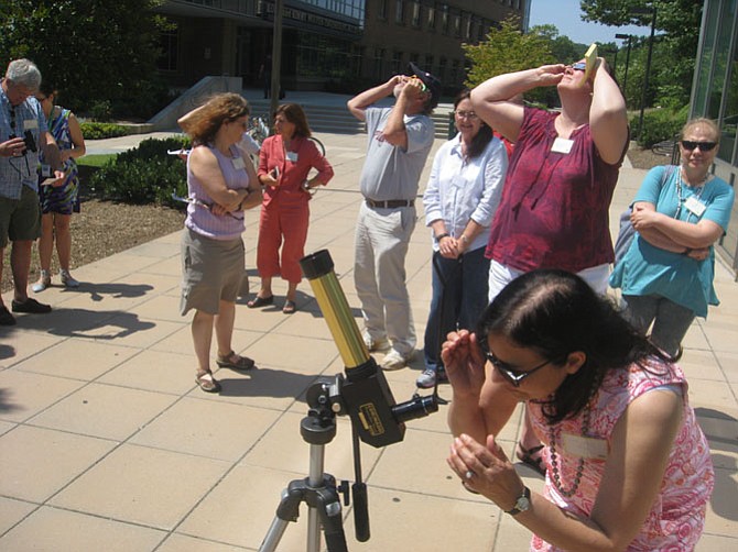 George Mason professor Harold Geller led a workshop for science teachers that included an outdoor session on viewing the Sun and the upcoming solar eclipse safety.