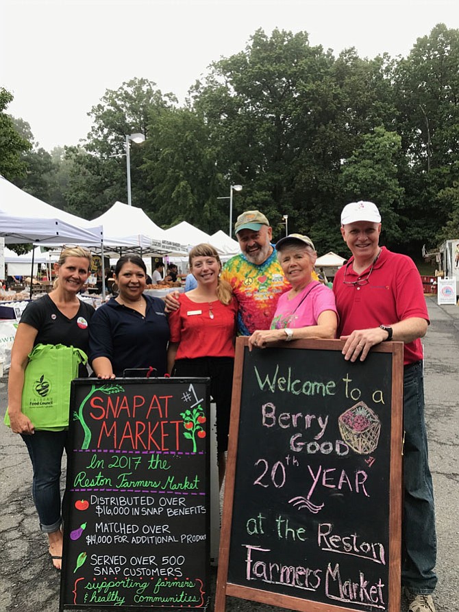 From left: Terri Siggins, Fairfax Food Council and Minnie Orozco, Cornerstones, with Chelsea Roseberry, Fairfax County Farmers Market Coordinator; John and Fran Lovaas, Reston Farmers Market Managers; and  Bill Threlkeld, of Cornerstones, before the National Farmers Market Week Celebration held at the Reston Farmers Market, Saturday, Aug. 12.