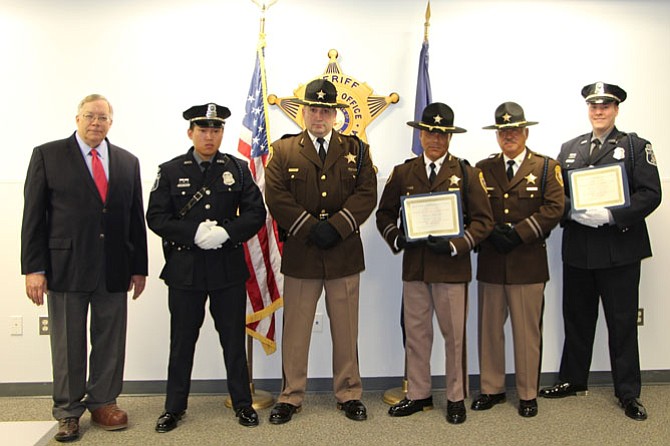 George Washington Birthday Parade Committee chair Joe Shumard (far left) presents certificates to United Honor Guard members (from left) Officer Binh Vu, Lieutenant Robert Gilmore, Deputy Juan Guzman, Deputy Ernesto Arroyo and Officer Joshua Leach Aug. 2 at the Alexandria Sheriff’s Department Headquarters. The United ASO-APD Honor Guard received third place in the Honor Guards and Color Guards category at the GW Parade earlier this year.