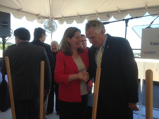 Mayor Allison Silberberg congratulates Virginia Governor Terry McAuliffe (D) at the 395 Express Lanes groundbreaking ceremony, Wednesday, Aug. 9. The new express lanes will go through part of Alexandria and Arlington before ending at the Potomac River. The lanes are expected to be open in fall 2019.
