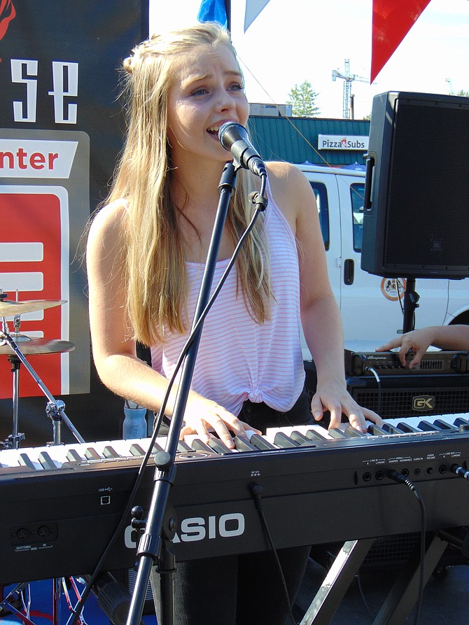 Singer Claudia Swope performs at the Bands for Bikes Concert at the Old Firehouse in McLean on Saturday, Aug. 19, 2017.
