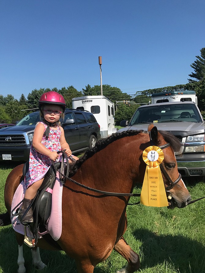 Frankie Schofield 2, of Round Hill shows off her sister Ryleigh's pony at Turner Farm Events' Summer Horse Trials, Combined Test, and Dressage Show held Sunday, Aug. 20 at The Turner Farm.
