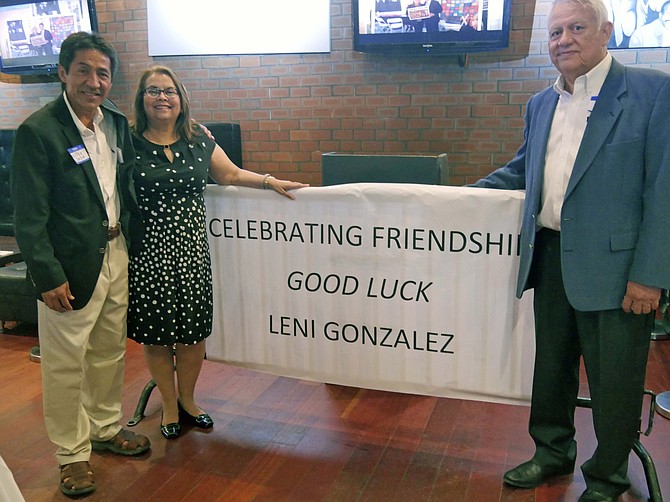 No one wanted to say goodbye to Leni Gonzalez after her years of leadership improving the quality of life for Latinos and immigrant families in Arlington. So Tuesday, Aug. 15, a “Celebrating Friendship” dinner was held at the Salsa Room on Columbia Pike to express the appreciation and gratitude of the people she has touched over the years. Gonzalez is moving to El Salvador in a couple of weeks to join her husband who has emerged from retirement to begin a new career there. Above are Walter Tejada, former County Board chair who worked with Gonzalez on many projects over the years (left), Leni Gonzalez and Andres Tobar, executive director of Shirlington Employment and Education Center (SEEC) of which Gonzalez was recent chair of the board. 
