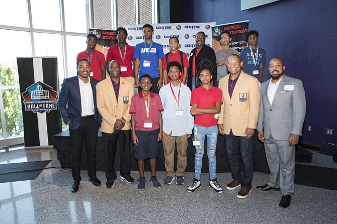 Keynote Speakers/Pro Football Hall of Famers Darrell Green (front row-second from left) and Aeneas Williams (front row-second from right) with 100 Black Men of Greater Washington, D.C. mentors Travis Reed and James Thompson and students.