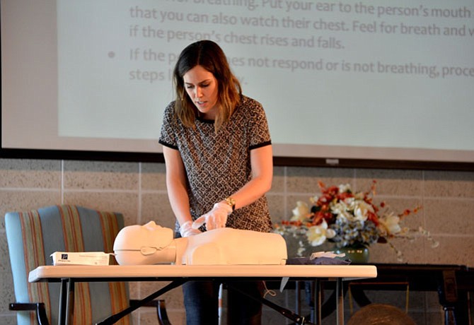 Ginny Atwood Lovitt, director of the Chris Atwood Foundation, shows the class how to recognize the symptoms of an opioid overdose and how to respond. After the training, the CAF and REVIVE! made Narcan kits for reversing the effects of an overdose available.
