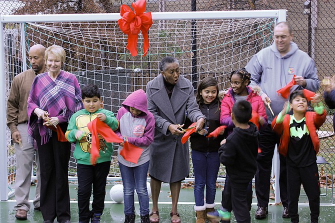 Supervisor Catherine M. Hudgins (middle) at the ribbon cutting ceremony at Southgate Community Outdoor Soccer Court.
