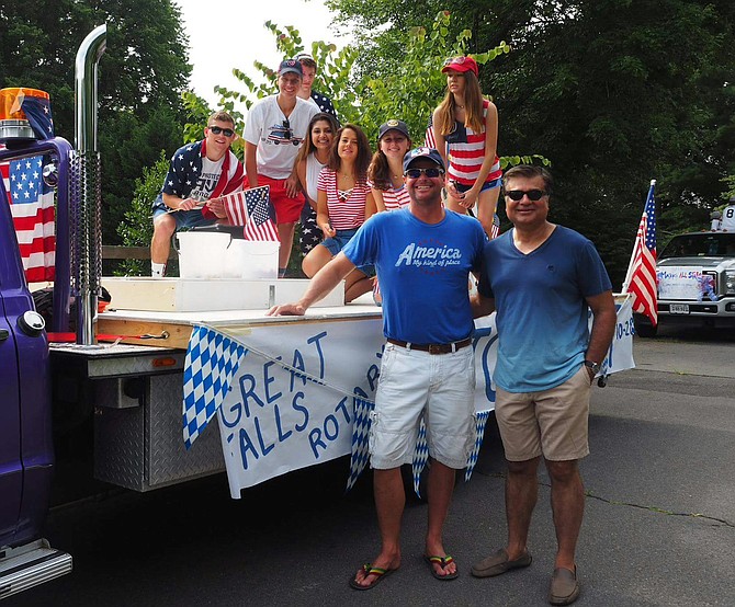 The current president of Great Falls Rotary Vishal Chawla and current vice president Butch Sevila pictured with the Club’s float at the Fourth of July celebration in Great Falls.