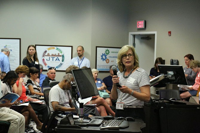 Fairfax County Zoning Administrator Leslie Johnson addresses the community during an open house about zMod, the county’s initiative to modernize its Zoning Ordinance.