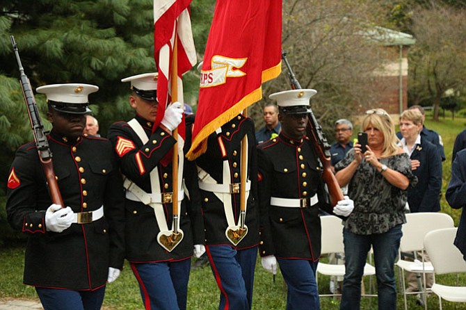 A Marine Corps Color Guard from Navy Joint Base Anacostia-Bolling in Washington, D.C., carried the national colors for the 9/11 ceremony at the Great Falls Freedom Memorial on Monday evening, Sept. 11. Marines, from left: Lance Cpl. Peter Kanyita, Sgt. Keith Norman, Cpl. Jason Stolecki and Lance Cpl. Tyree Edmond.
