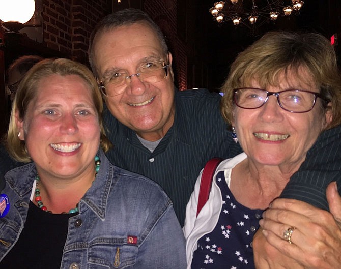 (From left) Jennifer Passey celebrates with School Board member Mitch Sutterfield and his wife Carolyn.