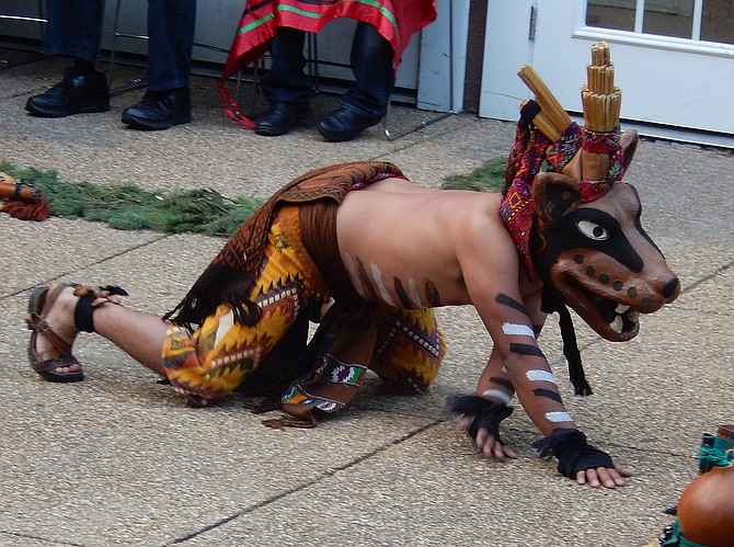One of the dancers portrayed an angry, snarling animal.