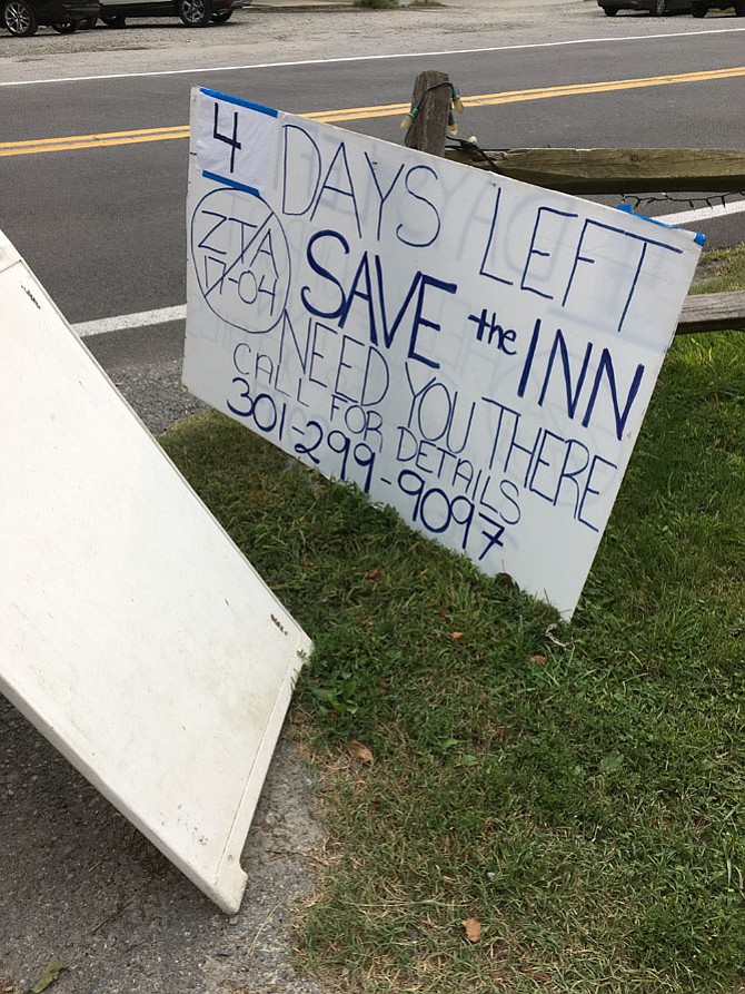 Sign in front of Old Angler's Inn solicits support for the proposed Country Inn on acreage behind the restaurant.