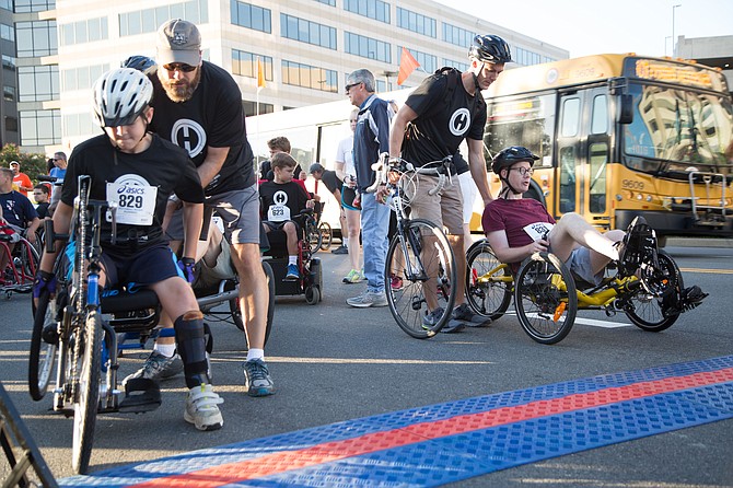 Racers prepare to begin the 14th annual Super H 5K race Sunday morning, Sept. 24 in Tysons Corner.