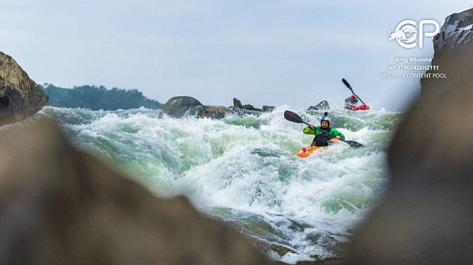 Rafa Ortiz, professional Red Bull kayaker, descends the Great Falls rapids Sept. 6 in a private event for Red Bull extreme sports.