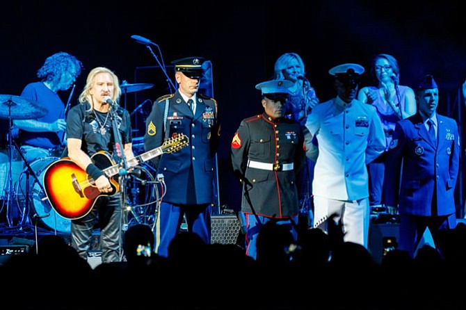 Joe Walsh pays tribute to service members of the U.S. military during the Sept. 20 VetsAid concert at Eagle Bank Arena.