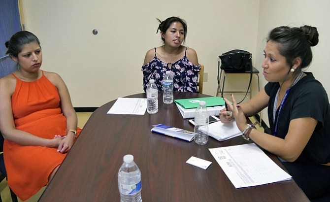 Lizzett Uria, director of the Dream Project, with two scholarship recipients, Katherine Garcia-Ortiz and Chelssi Jiminez-Flores.