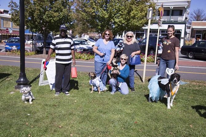 Thomas Barnes of the town of Herndon and his dog Tyco, a 5-year-old Shih Tzu, won first place in the costume contest as a “bad to the bone” inmate; a “Wizard of Oz” contingent of three rescue dogs won second place, Dian Rosen-Cornwell of the town of Herndon with her mixed-breed Bailey as Dorothy and Stacey Tignor of the town of Herndon with her dachshund Mimi dressed as the Scarecrow and her Chihuahua Baxter dressed as a flying monkey; and Kristen Gardner of Sterling won third place with her 8-year-old Labrador-Border Collie mixed-breed Bentley dressed as a toy fairy.