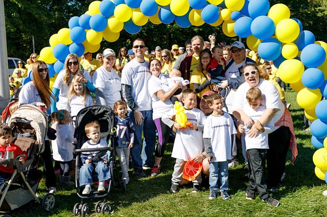 Team Emma Strong poses for a photo following the DSANV Buddy Walk Oct. 1 in Fairfax. Emma Laukhuf, daughter of Kent and Dana Laukuf, was born last December with Down syndrome.