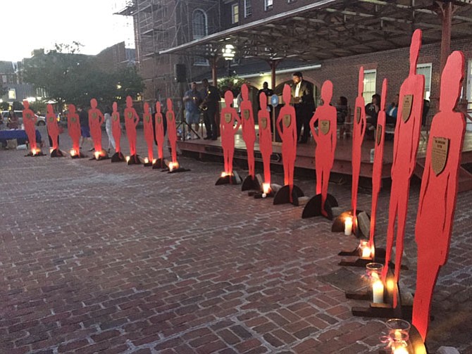 Cut-outs representing Alexandria’s victims of domestic violence.