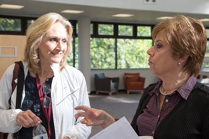 Nancy Gravatt (Left), communications for Fairfax Public Libraries, speaks to Daniela Dixon, branch manager for the Tysons Pimmit Regional Library Wednesday, Oct. 4.