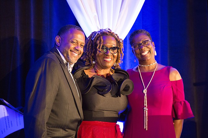 Mark Moore (left) and Brenda Moore (right) pause for a picture with Publisher and CEO of VA WOMAN Magazine Group Dorri Scott, who served as the 2017 Raise the Region Gala Mistress of Ceremonies (center), after being honored with the 2017 Community Leadership Award.
