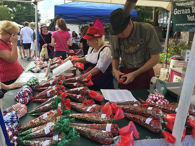 David Hughes and his wife Rose of Frederick offer some traditional German nuts.