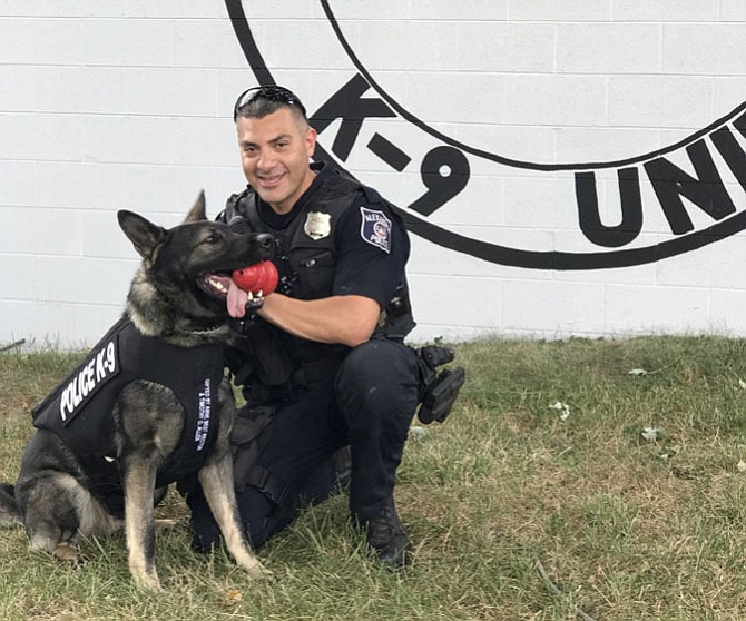 Alexandria Police Department K9 Zeus, with Officer Tarek Helmy, received a new ballistic and stab-protective vest Oct. 4 courtesy of the nonprofit Vested Interest in K9s and a donation from local residents Anne Best Rector and Tim Allen.
