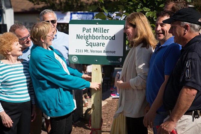 Pat Miller, third from left, is honored Oct. 7 at the dedication of the Pat Miller Neighborhood Square, located at the intersection of Mount Vernon and Oxford Avenues in Del Ray.