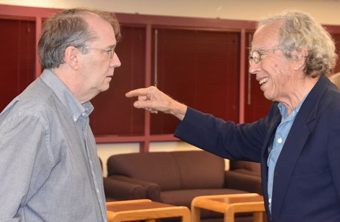 Ralph Buglass, who spoke about the early history of Potomac at the West Montgomery County Citizens Association's October meeting, listens to a story from Mark Israel after the meeting.