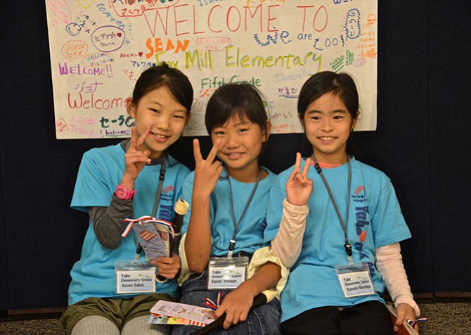 Azusa Sakai, Sayuri Iyonaga and Kanami Ninomiya share their hopes for peace after the special assembly at Fox Mill Elementary, where the young trio and seven of their school chums have been visiting as exchange students, hosted by families of Fox Mill students.