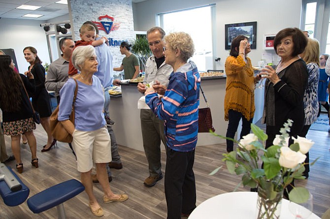 Friends and family of past gym owner Joe Cassella gathered for the re-opening of Elite Fitness in Great Falls on Saturday.