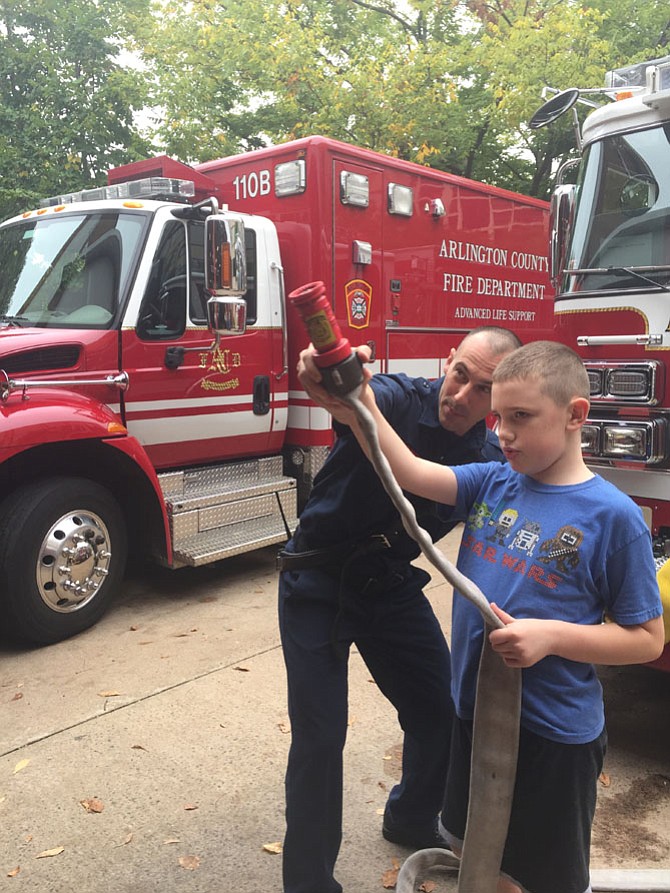 Firefighter Ted Schweitzer (left) and Elias Tapp.
