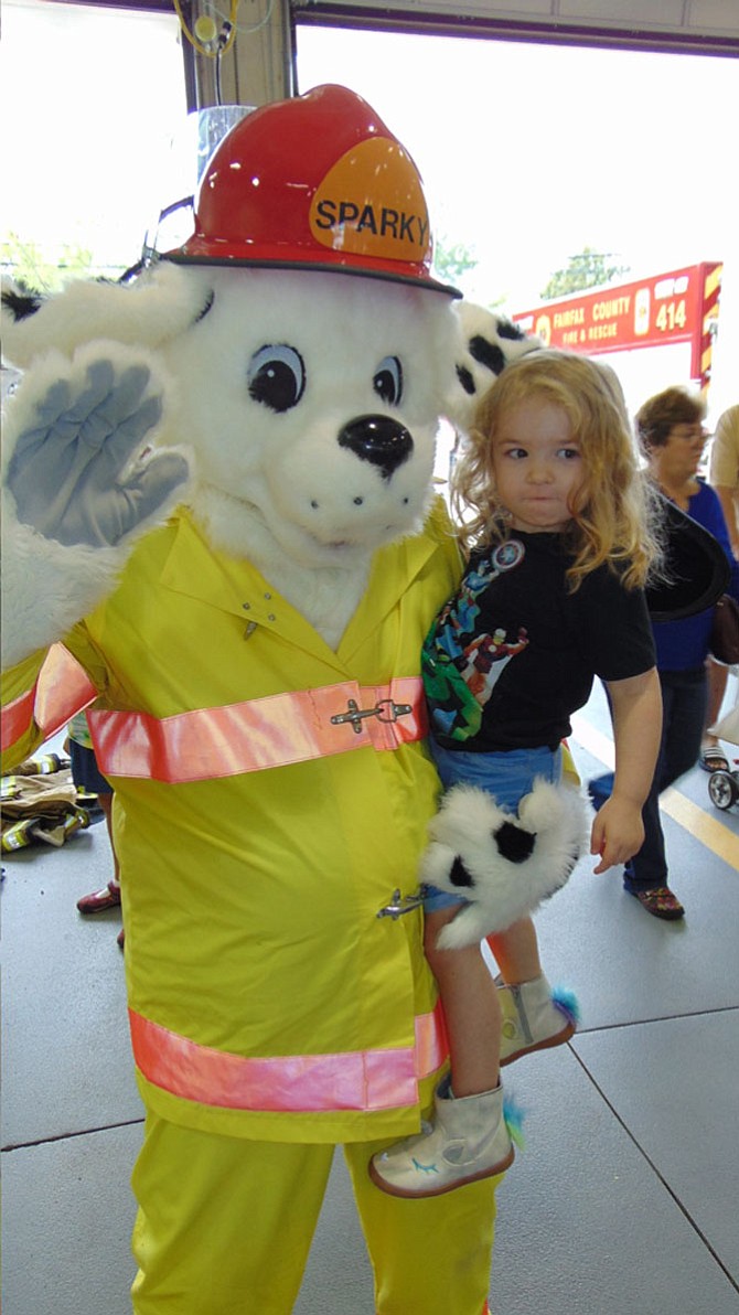 Cleo Methvin, age 4, of Burke with Sparky the Fire Dog during the Open House at Burke Volunteer Fire and Rescue Department's Station #14 on Saturday, Oct. 14, 2017.