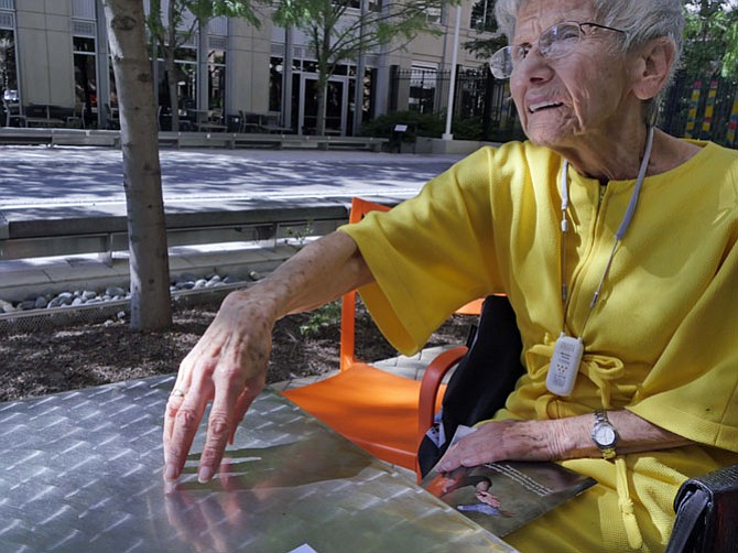 Norma Kacen of Arlington traces circles of neighborhood ghettos on the table, remembering her youth.