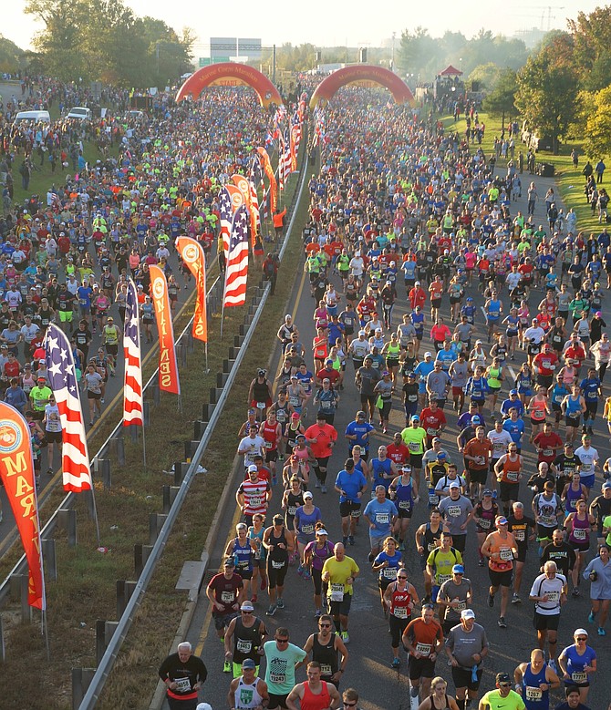 More than 30,000 runners crowd the streets of Arlington at the start of the 42nd annual Marine Corps Marathon Oct. 22.
