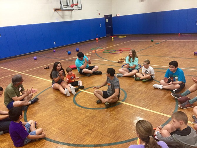 Students at Bishop Denis J. O’Connell High School volunteer to provide sports and recreational activities for children and young adults with developmental and physical disabilities.
