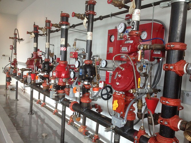 In the Fire Alarm and Sprinkler Systems Training Lab, various types of firefighting hook ups are displayed.
