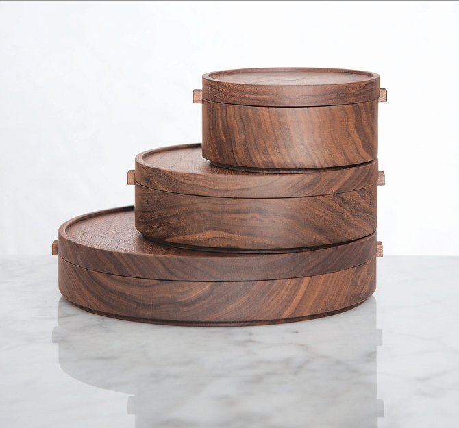 Stackable, food-safe wooden bowls, such as these by Thos. Moser, Handmade American Furniture, are sustainable and reusable.
