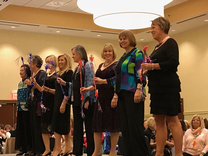 From left: runway models Elma Mankin, Barbara Torrey, Wanda Mitchell, Peggy Lanier, Joanne Emswiler, Kathy Herbert, Gabriele O’Bryan, and Linda Crawford take a bow at the end of the Herndon Woman's Club Fashion Show 2017. Proceeds from the show benefitted Luke's Wings.
