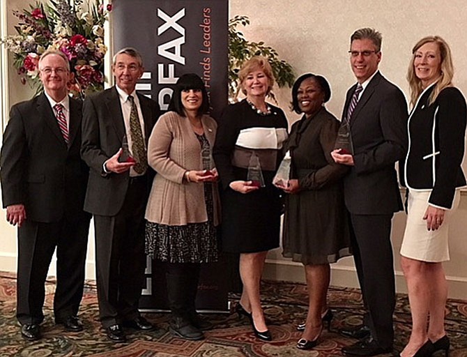 From left: Leadership Fairfax Board Chairman Tim Sargeant, Dominion Energy; Stephen Fuller accepting for Bob Buchanan, president, the 2030 Group, Regional Leadership Award; Rikki Epstein, The Arc of Northern Virginia, Nonprofit Leader Award; Patti Stevens, Executive Director, Fairfax County Office of Public-Private Partnerships, Trustee Leadership Award; Phyllis Pajardo, Superintendent, City of Fairfax Schools, Educational Leadership Award: Mike Coogan, for Leidos, Corporate Leadership Award; and Karen Cleveland, president and CEO, Leadership Fairfax. 