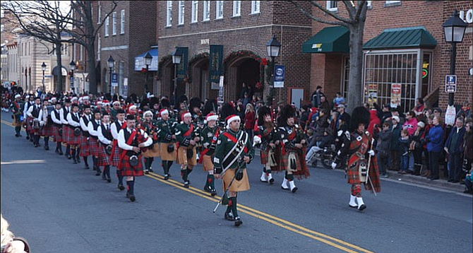 The Northern Virginia Firefighters Emerald Society Pipe Band marched up King Street at the 45th annual Scottish Christmas Walk parade in 2015. 